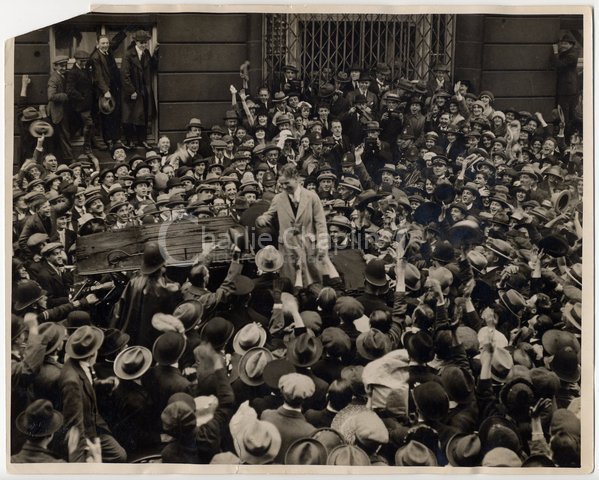 A crowd welcomes Chaplin in London, 1921