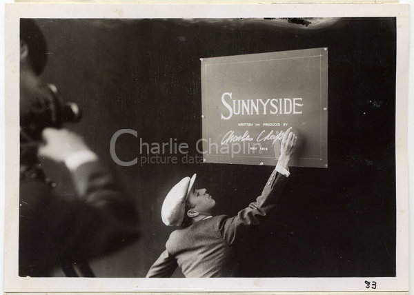 Chaplin signing the title card for Sunnyside