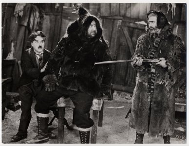 Gold_rush_in_hut_scene_medium