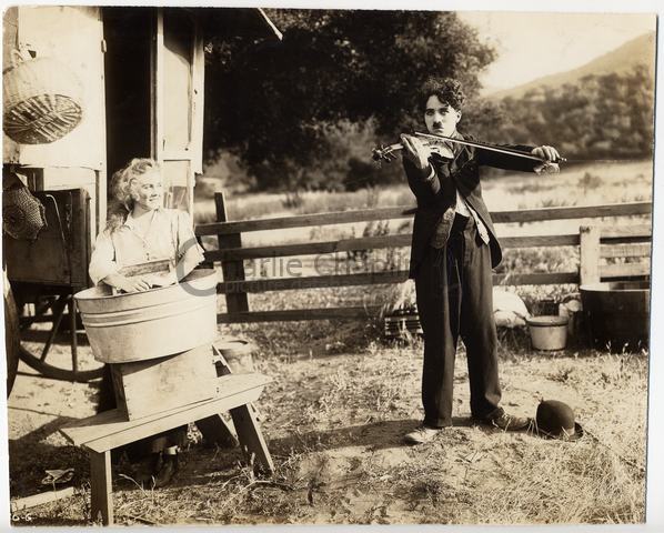 Chaplin plays the violin in The Vagabond, 1916