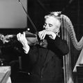 Chaplin_playing_violin_and_harp_square