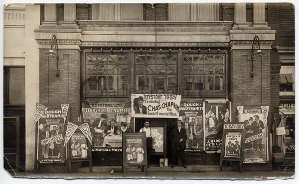 Posters for "Dough and Dynamite" ouside a cinema