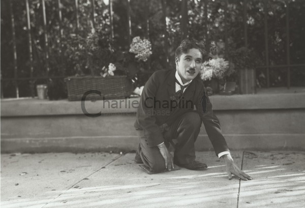 Chaplin directing Cherrill by acting the part of the blind girl, showing her what he wanted her to do