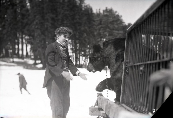 Chaplin with a bear on location in Truckee, California during the shoot