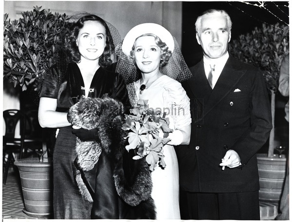 Paulette Goddard, Mary Pickford and Charles Chaplin at Pickford's wedding to Buddy Rogers, 1937