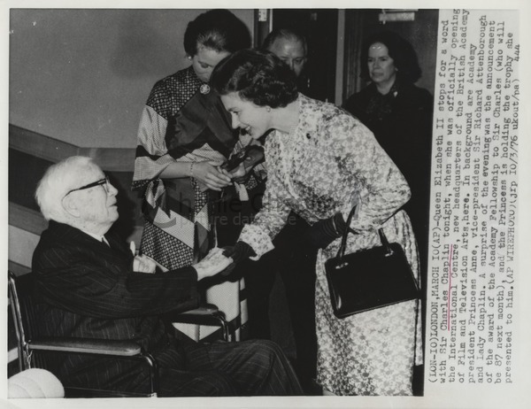 Queen Elizabeth II takes Charles Chaplin's hand at the opening of the British Academy of Film and Television Arts (BAFTA) ceremony, 1976