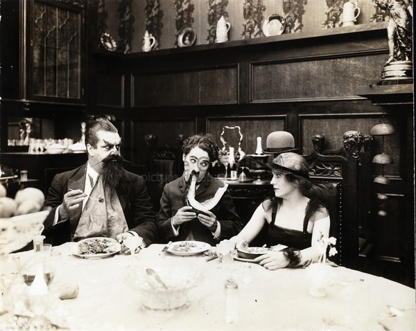 Eric Cambell, Charlie Chaplin and Edna Purviance in The Count, 1916