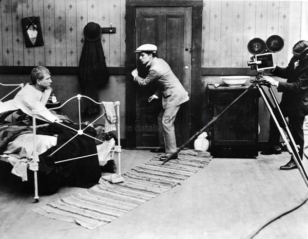 Tom Wilson, Charles Chaplin and Roland Totheroh on the set