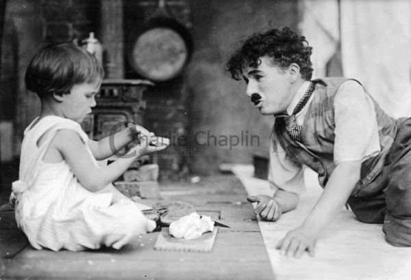 Jackie Coogan and Charlie Chaplin on the set of The Kid
