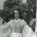 Victoria Chaplin in the garden wearing wings