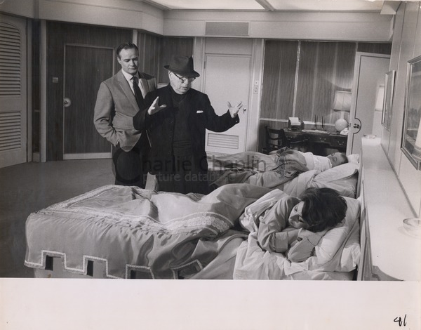 Charlie Chaplin directing Marlon Brando and Sophia Loren