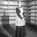 Joan Barry in dark dress and apron