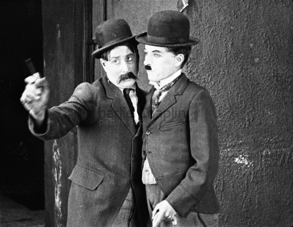 Sydney (Charlie's brother) and Charlie Chaplin in Pay Day (1922)