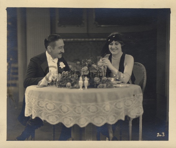 Adolphe Menjou and Edna Purviance
