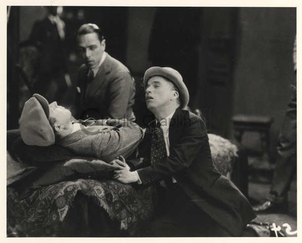 Chaplin demonstrating to Edna Purviance how he would like a scene to be played