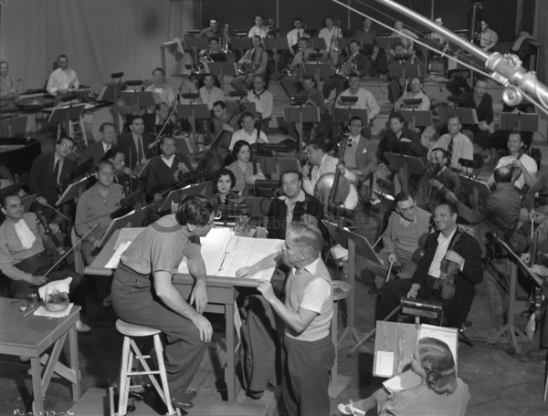 Meredith Willson (on podium) with Chaplin during the recording sessions for The Great Dictator, August 1940