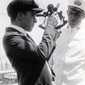 Charles Chaplin posing with a crew member on the deck of a ship