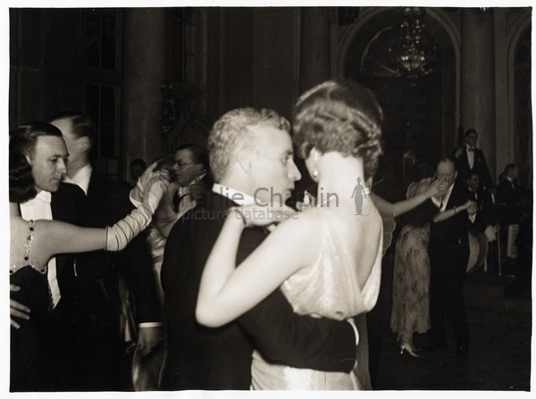 Charles Chaplin dancing with a blond woman at a party for the London ...