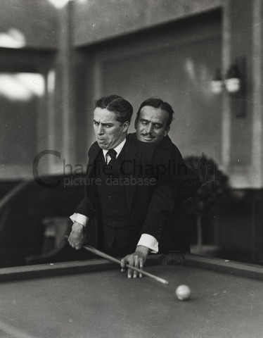 Douglas Fairbanks, Edward Knoblock and Charles Chaplin playing pool -  Charlie Chaplin Image Bank